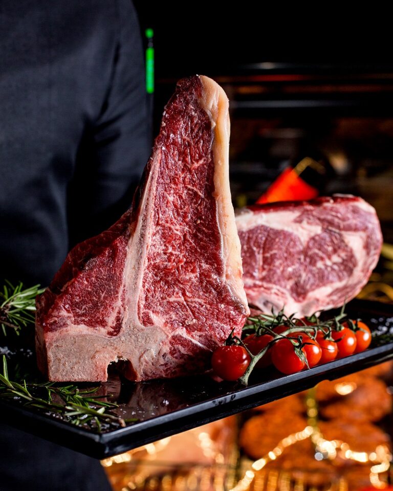 meat steaks with rosemary and tomatoes